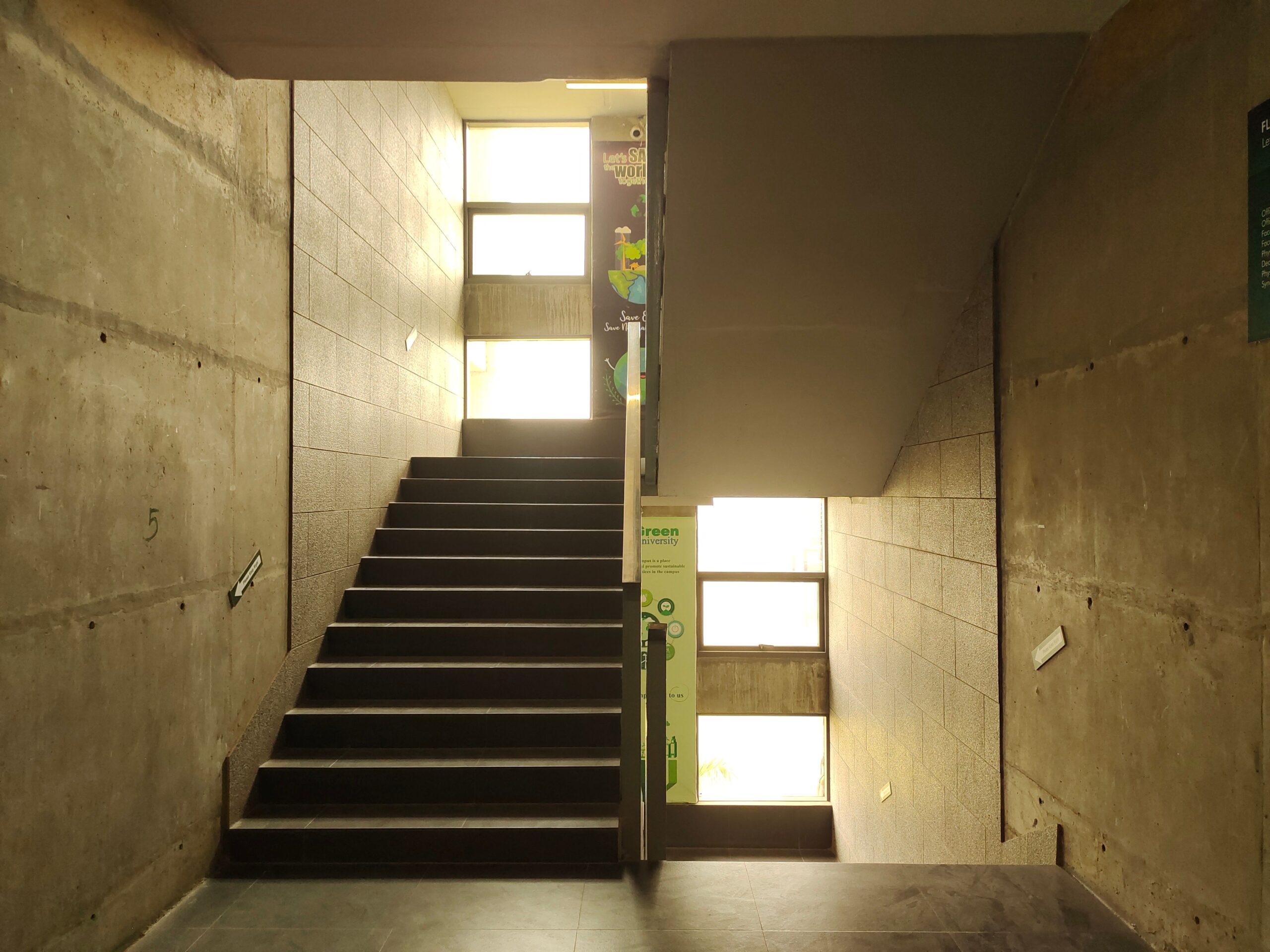 Concrete staircase and walls with windows, Kanchon, Bangladesh interior architecture.
