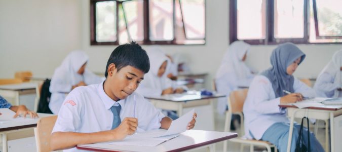 High school students in Indonesia studying in a classroom setting.